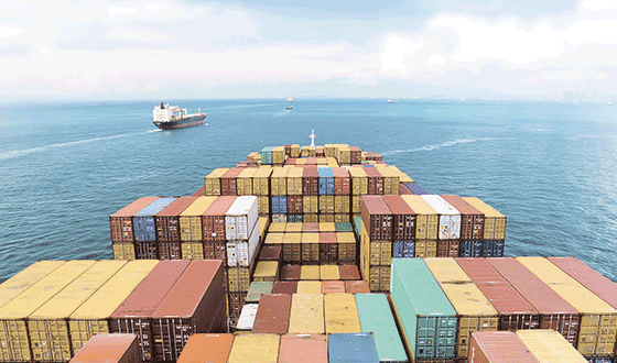 Detail of a ship loaded with containers on the open sea